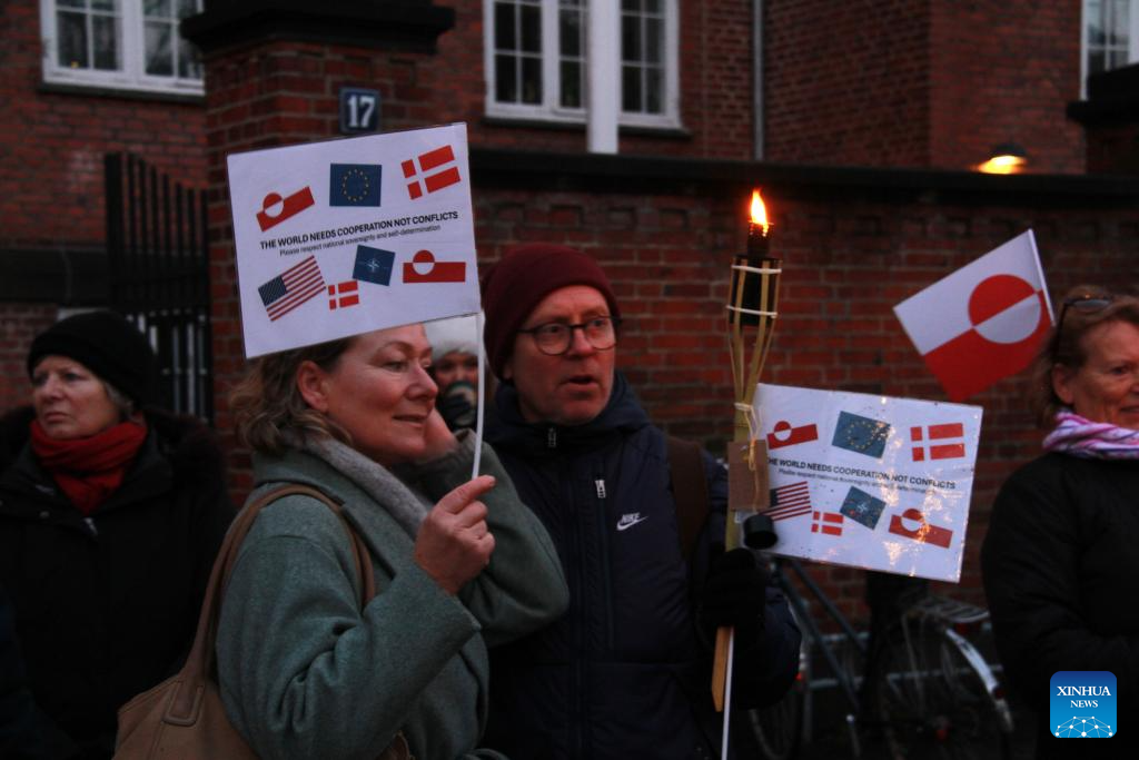 People participate in a protest against U.S. plans on Greenland in Copenhagen, Denmark, Jan. 14, 2026. About 200 protesters rallied outside the U.S. Embassy in Denmark Wednesday, expressing opposition to Washington's plans on Greenland as Danish and Greenlandic officials met with U.S. Vice President JD Vance and Secretary of State Marco Rubio in Washington. (Photo by Liu Zhichao/Xinhua)