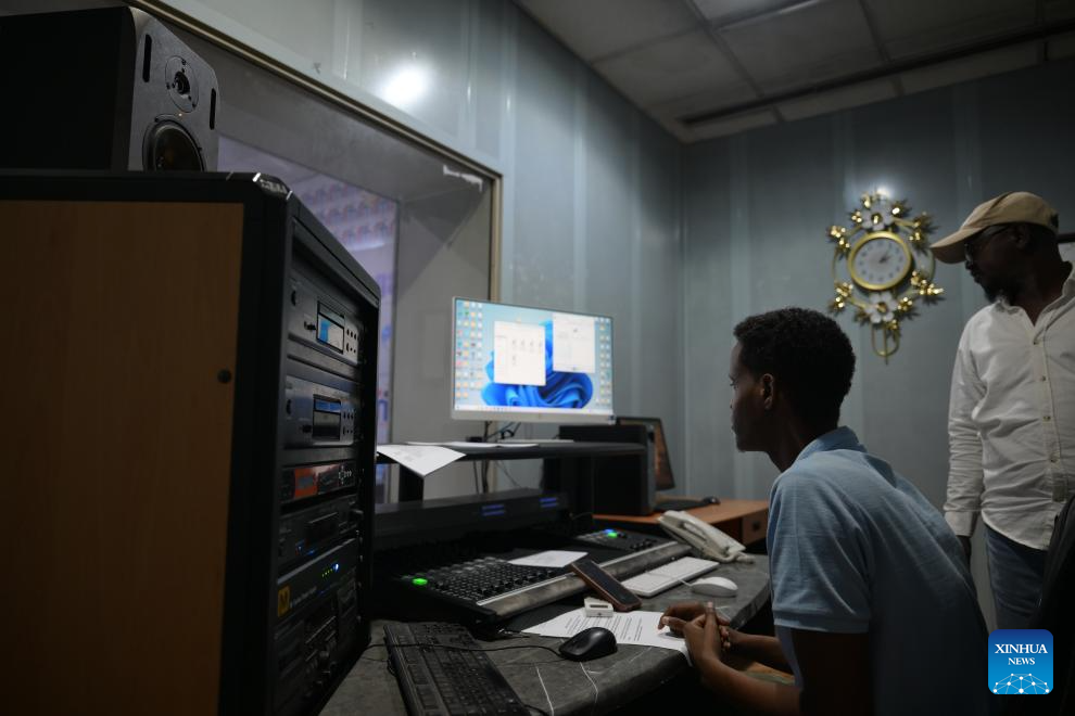 Staff members work at the recording room of Radio Mogadishu in Mogadishu, Somalia, on Jan. 12, 2026. Radio Mogadishu, established in 1951, is one of the official state-run broadcasting organizations in Somalia. The archives of Radio Mogadishu houses a large number of historical audio files, including music, poetry, interviews, political speeches and other contents, which record the social and cultural process of Somalia in recent decades. (Xinhua/Yang Guang)