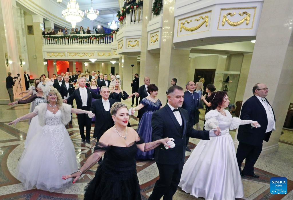 People dressed in festive costumes attend a ball in Minsk, capital of Belarus on Jan. 13, 2026. A ball was held here to welcome the upcoming old calendar New Year. (Photo by Henadz Zhinkov/Xinhua)