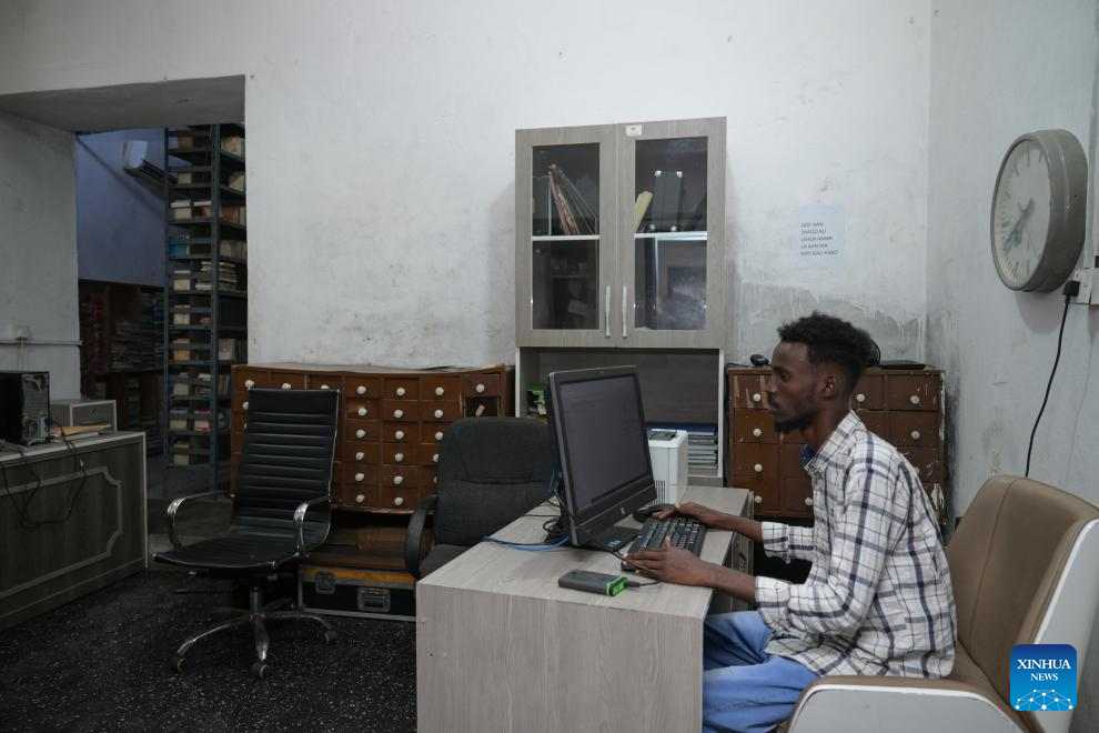 A staff member works at the archives of Radio Mogadishu in Mogadishu, Somalia, on Jan. 12, 2026. Radio Mogadishu, established in 1951, is one of the official state-run broadcasting organizations in Somalia. The archives of Radio Mogadishu houses a large number of historical audio files, including music, poetry, interviews, political speeches and other contents, which record the social and cultural process of Somalia in recent decades. (Xinhua/Yang Guang)