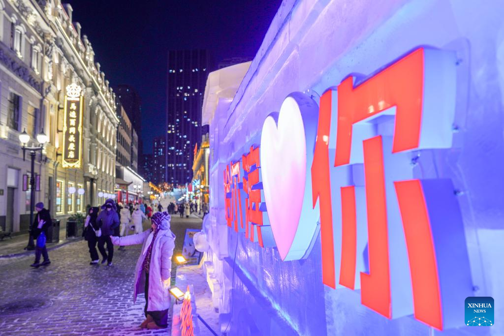 A tourist poses for photos at the Chinese Baroque Historic and Cultural Block in Harbin, northeast China's Heilongjiang Province, Jan. 13, 2026. Harbin is a major winter tourism destination in northeast China. The city's Chinese Baroque Historic and Cultural Block is attracting an increasing number of visitors. The century-old architectural complex, a fusion of Chinese and Western styles, displays a unique charm as the ice and snow season peaks. (Xinhua/Wang Jianwei)