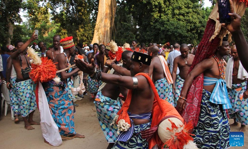 Locals dressed in traditional costumes dance to celebrate the Vodun Days in Ouidah, Benin, Jan. 8, 2026. The 2026 edition of Vodun Days is held from Jan. 8 to 10 in Ouidah, a historic cultural city in southwestern Benin, showcasing the diversity and vitality of Vodun culture through ritual demonstrations, dance and music performances, and art exhibitions. (Photo: Xinhua)