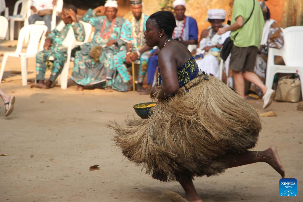 A woman dressed in traditional costumes performs a dance to celebrate the Vodun Days in Ouidah, Benin, Jan. 8, 2026. The 2026 edition of Vodun Days is held from Jan. 8 to 10 in Ouidah, a historic cultural city in southwestern Benin, showcasing the diversity and vitality of Vodun culture through ritual demonstrations, dance and music performances, and art exhibitions. (Photo: Xinhua)