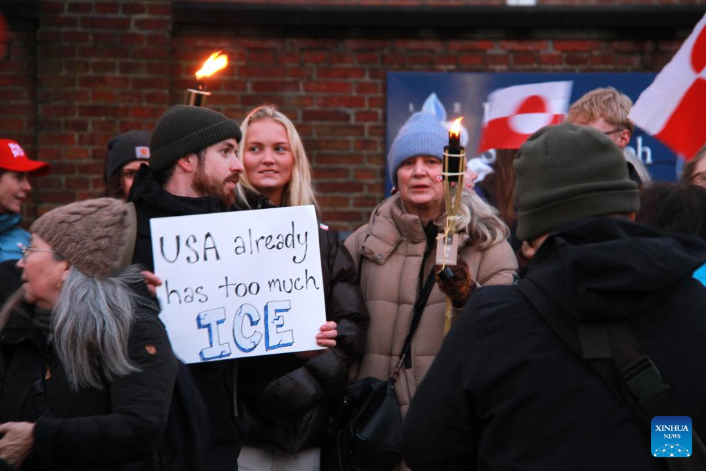 People participate in a protest against U.S. plans on Greenland in Copenhagen, Denmark, Jan. 14, 2026. About 200 protesters rallied outside the U.S. Embassy in Denmark Wednesday, expressing opposition to Washington's plans on Greenland as Danish and Greenlandic officials met with U.S. Vice President JD Vance and Secretary of State Marco Rubio in Washington. (Photo by Liu Zhichao/Xinhua)