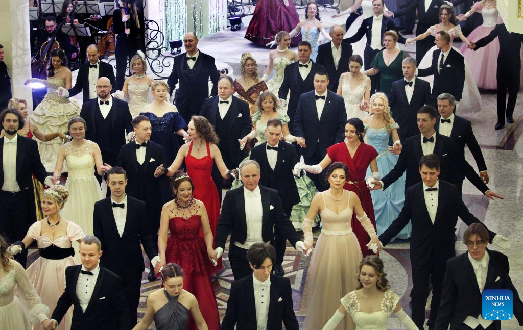 People dressed in festive costumes attend a ball in Minsk, capital of Belarus on Jan. 13, 2026. A ball was held here to welcome the upcoming old calendar New Year. (Photo by Henadz Zhinkov/Xinhua)