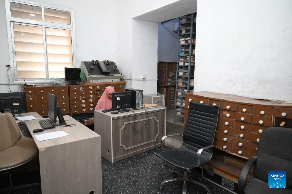 This photo taken on Jan. 12, 2026 shows a staff member working in the archives of Radio Mogadishu in Mogadishu, Somalia. Radio Mogadishu, established in 1951, is one of the official state-run broadcasting organizations in Somalia. The archives of Radio Mogadishu houses a large number of historical audio files, including music, poetry, interviews, political speeches and other contents, which record the social and cultural process of Somalia in recent decades. (Xinhua/Yang Guang)