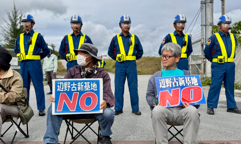 Local residents sit in silent protest at the entrance to the Henoko base construction site in Nago city, on December 24, 2025. Photo: Xing Xiaojing/GT