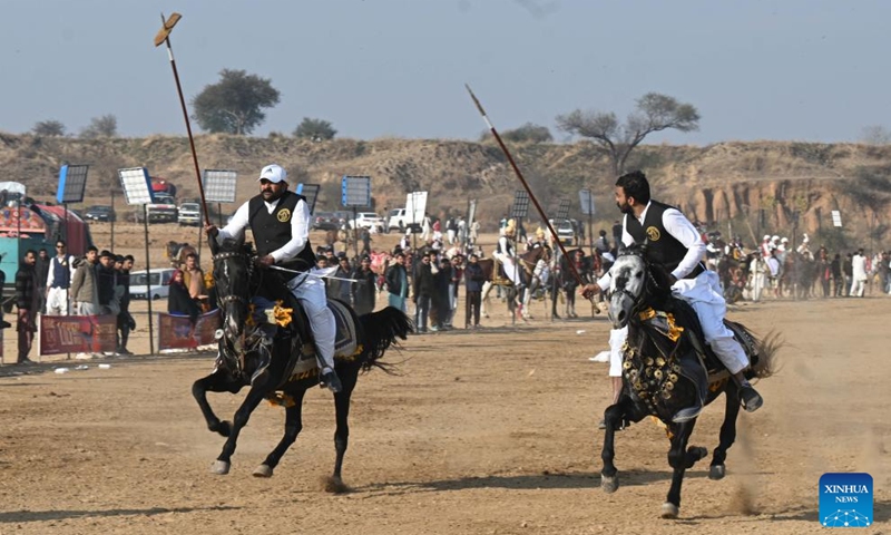 Riders compete during a tent pegging competition in Islamabad, Pakistan, Jan. 11, 2026. In tent pegging, a horseman gallops and uses a sword or a lance to pierce, pick up and carry away a wooden peg. Photo: Xinhua