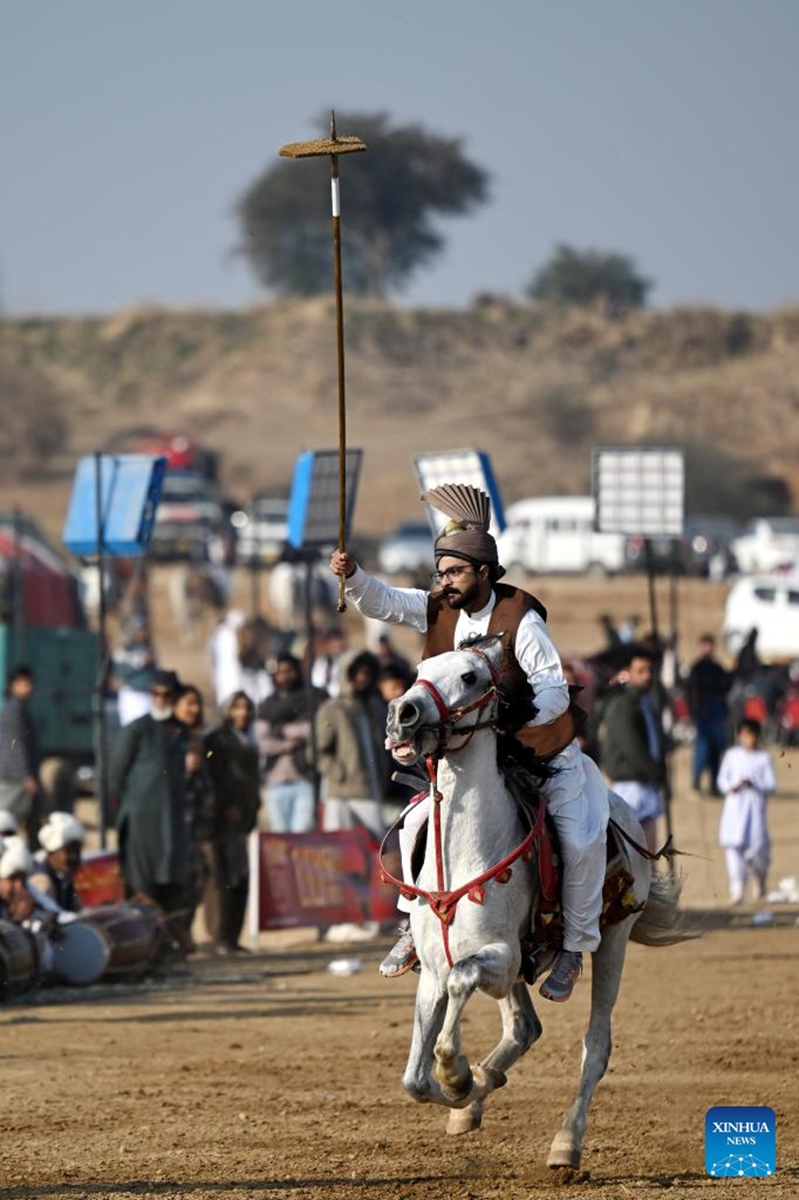 A rider competes during a tent pegging competition in Islamabad, Pakistan, Jan. 11, 2026. In tent pegging, a horseman gallops and uses a sword or a lance to pierce, pick up and carry away a wooden peg. Photo: Xinhua