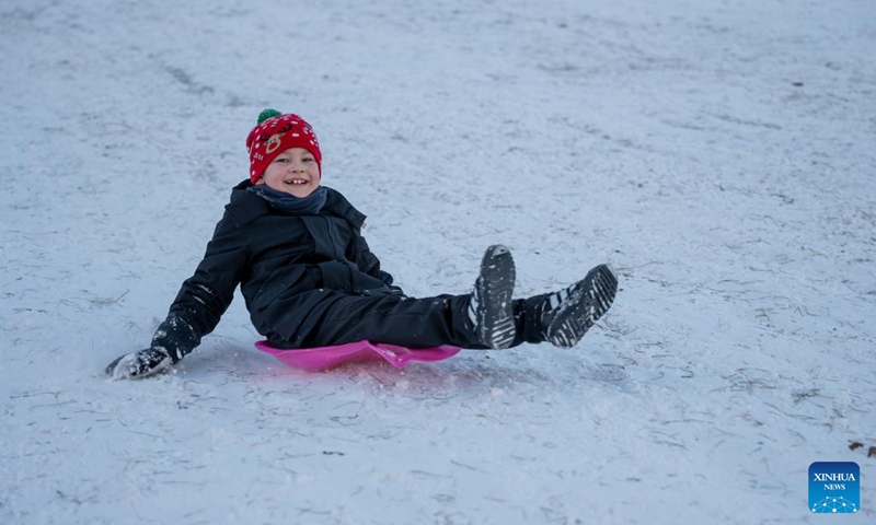A boy plays on a sledding hill in Prague, the Czech Republic, Jan. 11, 2026. (Photo by Dana Kesnerova/Xinhua)