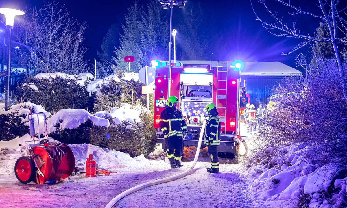 Firefighters arrive at a fire incident in a street in Thalheim, Germany at temperatures as low as minus 17 degrees on January 12, 2026. The operation was hindered by icy conditions and severe frost. Photo: VCG