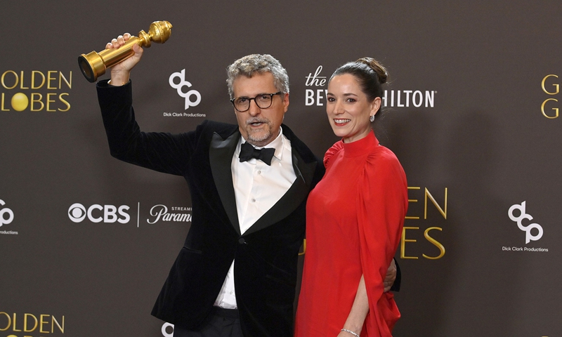 Kleber Mendon?a Filho and Emilie Lesclaux appear backstage after winning the award for Best Motion Picture - Non-English Language award for The Secret Agent during the 83rd annual Golden Globe Awards at the Beverly Hilton in Beverly Hills, California on January 11, 2026.  Photo: CFP