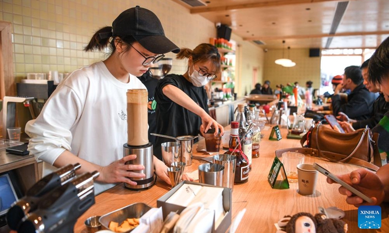 Baristas brew coffee at a coffee shop at a commercial complex in Guiyang, southwest China's Guizhou Province, Jan. 8, 2026. The city of Guiyang has been committed to the update and renovation of old commercial blocks, streets and factory areas. The renewed streets, such as Taiping, Minsheng, and Qingyun Roads have become vibrant spaces for relaxation and spending, driving urban consumption vitality and enhancing the city's youthful appeal. Photo: Xinhua