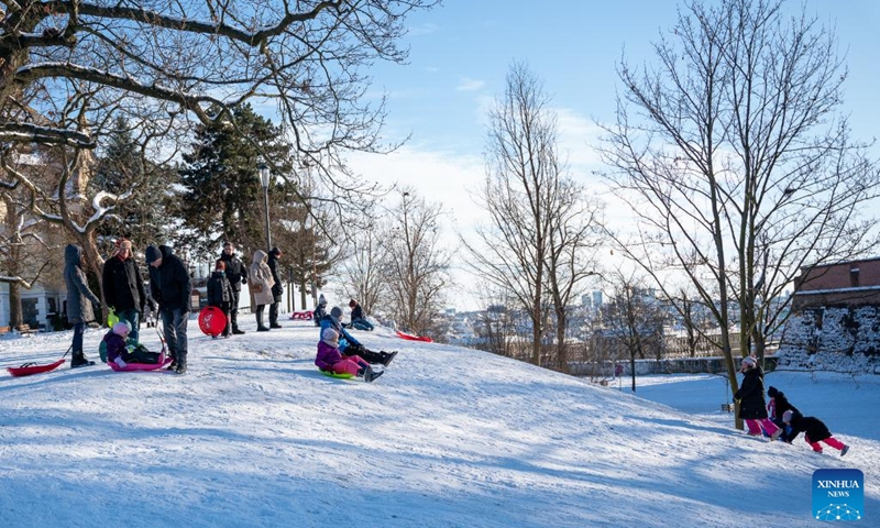 People play on a sledding hill in Prague, the Czech Republic, Jan. 11, 2026. (Photo by Dana Kesnerova/Xinhua)