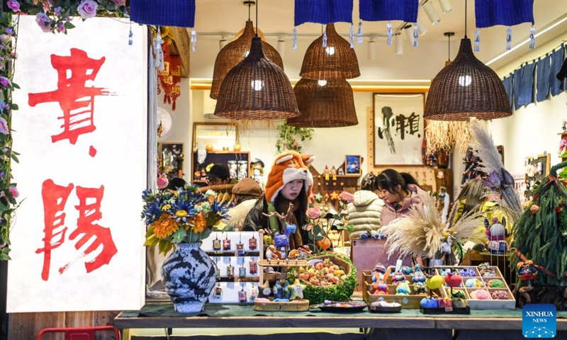 People visit the Qingyun Market in Guiyang, southwest China's Guizhou Province, Jan. 5, 2026. The city of Guiyang has been committed to the update and renovation of old commercial blocks, streets and factory areas. The renewed streets, such as Taiping, Minsheng, and Qingyun Roads have become vibrant spaces for relaxation and spending, driving urban consumption vitality and enhancing the city's youthful appeal.  Photo: Xinhua