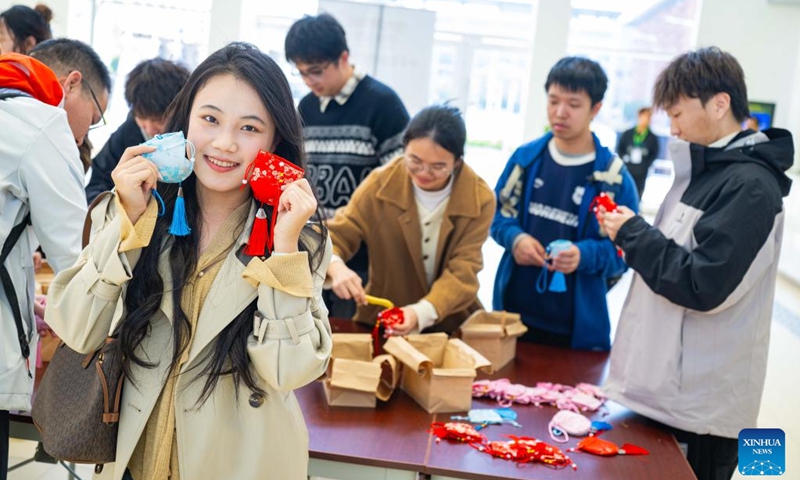 People make sachets at the University of Macao in Macao, south China, Jan. 11, 2026. The launch ceremony for the celebrations of the 45th anniversary of the University of Macao, along with an open-day event, kicked off here on Sunday. (Xinhua/Cheong Kam Ka)