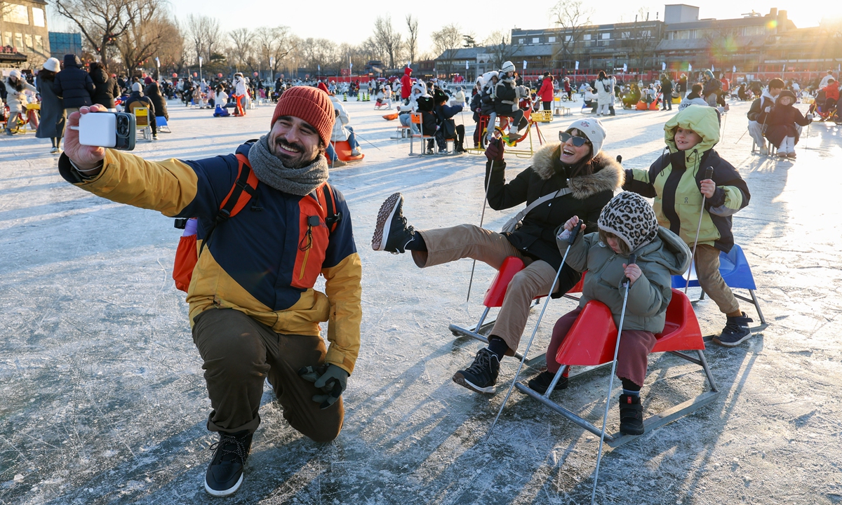 People enjoy ice cars and other activities on a sprawling 35,000 square meters ice rink at Beijing's Shichahai on January 11, 2026. The venue kicked off this winter's Ice and Snow Carnival on the day. Photo: Chen Tao/GT