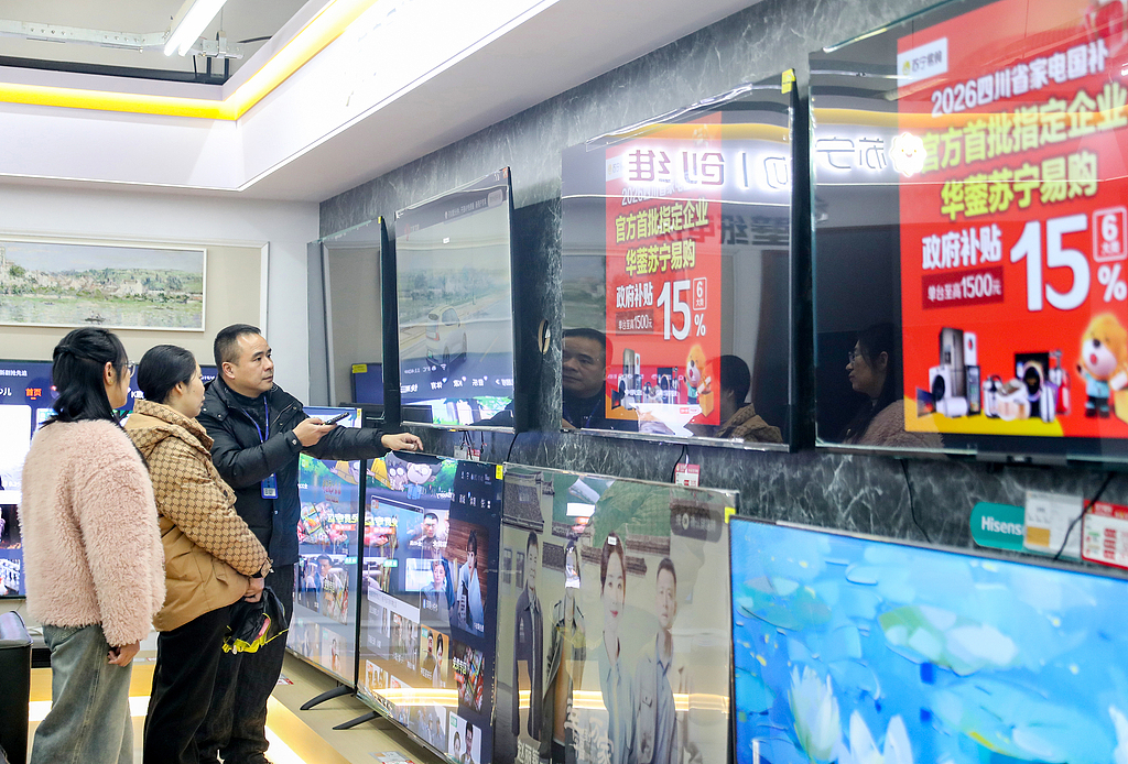 People snap up televisions eligible for the renewed trade-in subsidy program for consumer goods in Huaying, Southwest China's Sichuan Province, on January 19, 2026. With the program taking effect and the Spring Festival approaching, the city's home appliance market is drawing crowds and recording surging sales, ushering in the first consumption boom of 2026. Photo: VCG