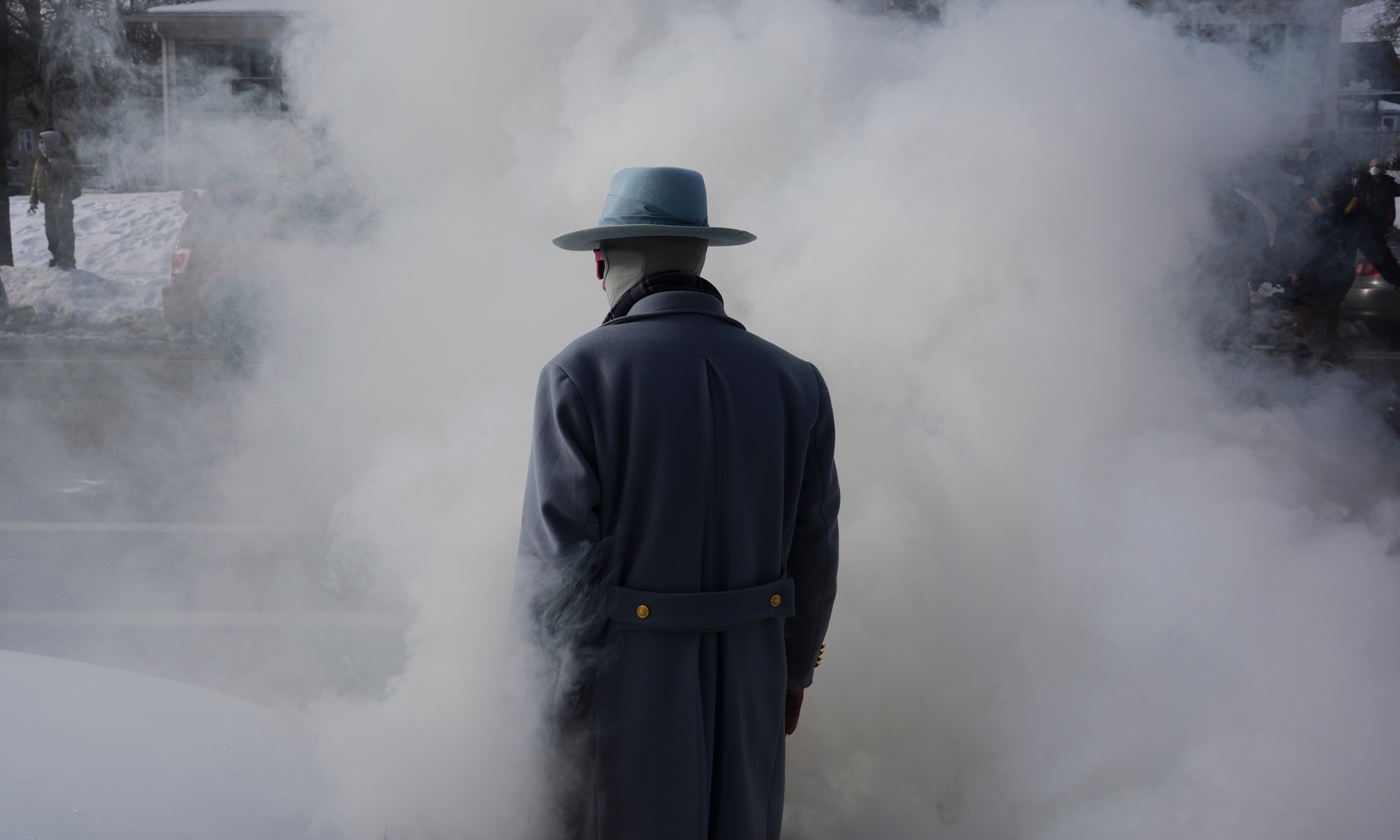 A man walks into smoke from tear gas dispersed by federal agents during a protest in Minneapolis, the US, on January 12, 2026. Photo: VCG 