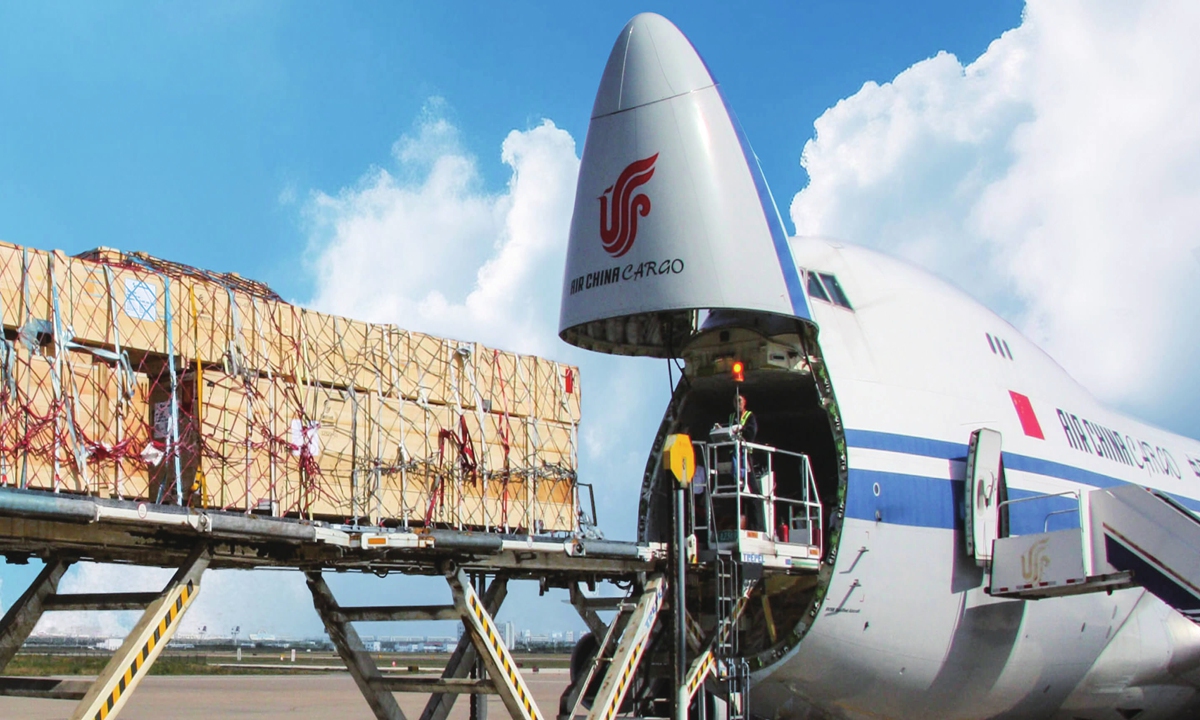 A worker loads cargo into an Air China plane.Photos on this page: Courtesy of MF/Milano Finanza
