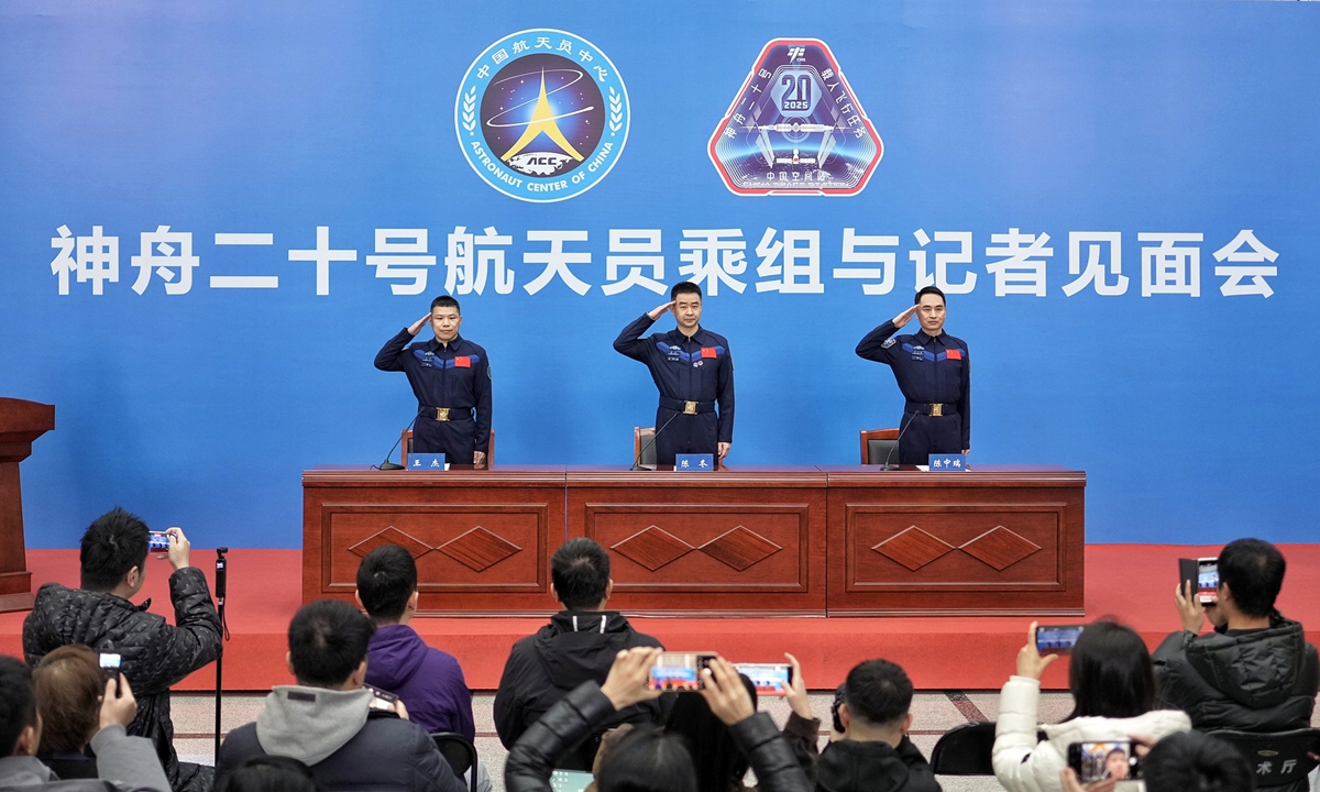 Taikonauts Chen Dong (center), Chen Zhongrui (right) and Wang Jie from China's Shenzhou-20 crewed mission salute during a press conference in Beijing, January 16, 2026. The three taikonauts met the press on the day, their first public appearance after returning to Earth in November, 2025. Photo: VCG