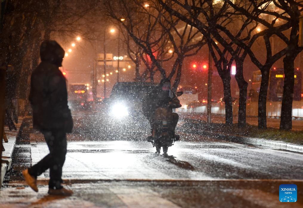 Citizens make their way amidst snowfall in Beijing, capital of China, on Jan. 17, 2026. Beijing witnessed a snowfall on Friday. (Photo: Xinhua)