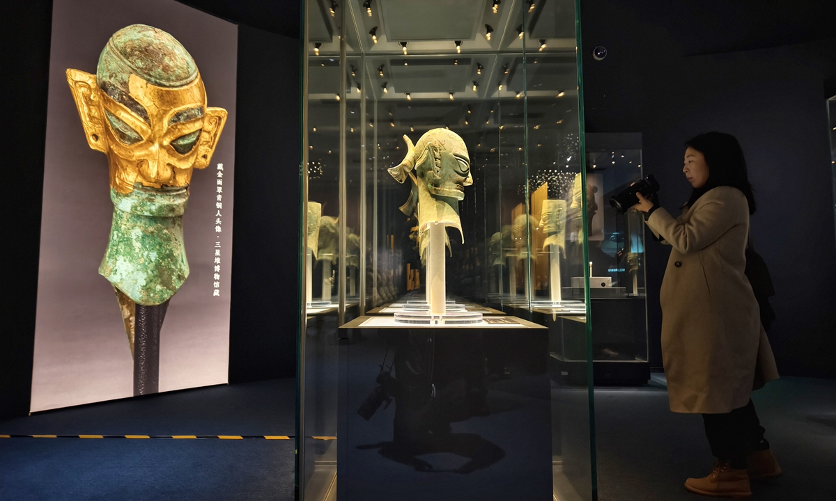 A visitor explores an exhibition named Ancient Shu Civilization of the Sanxingdui and Jinsha Sites at the National Museum of China in Beijing on January 18, 2026. Featuring more than 200 sets of relics from China's ancient Shu civilization, the exhibition kicked off earlier that day and is set to run until August 18. Photo: VCG