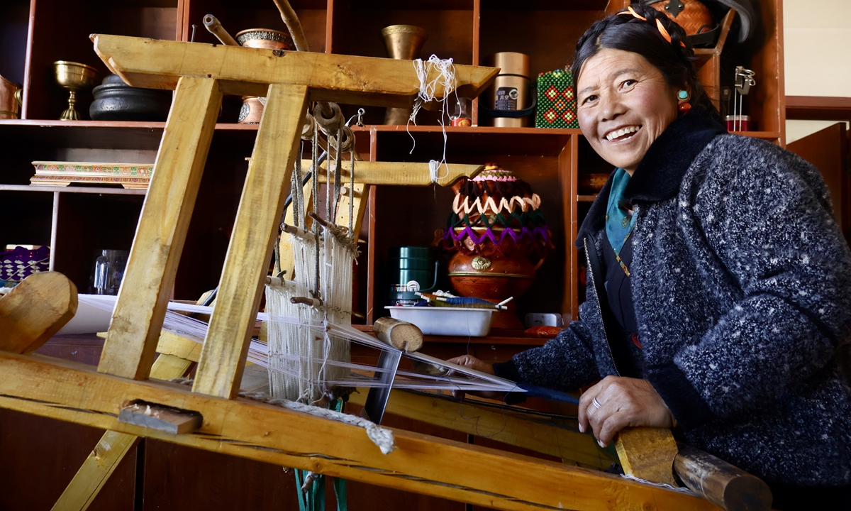 Nyima Drolma weaves fabric in her newly rebuilt home after the earthquake in Renda village in Lhaze County, Xigaze, Southwest China's Xizang Autonomous Region, on January 14, 2026. Photo: Lin Xiaoyi/GT
