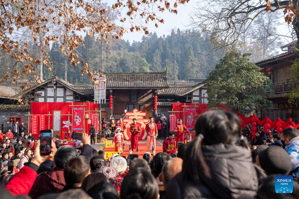 Visitors watch a traditional wedding ritual during a cultural tourism event at Shangli Ancient Town in Ya'an, southwest China's Sichuan Province, Jan. 17, 2026. (Photo: Xinhua)