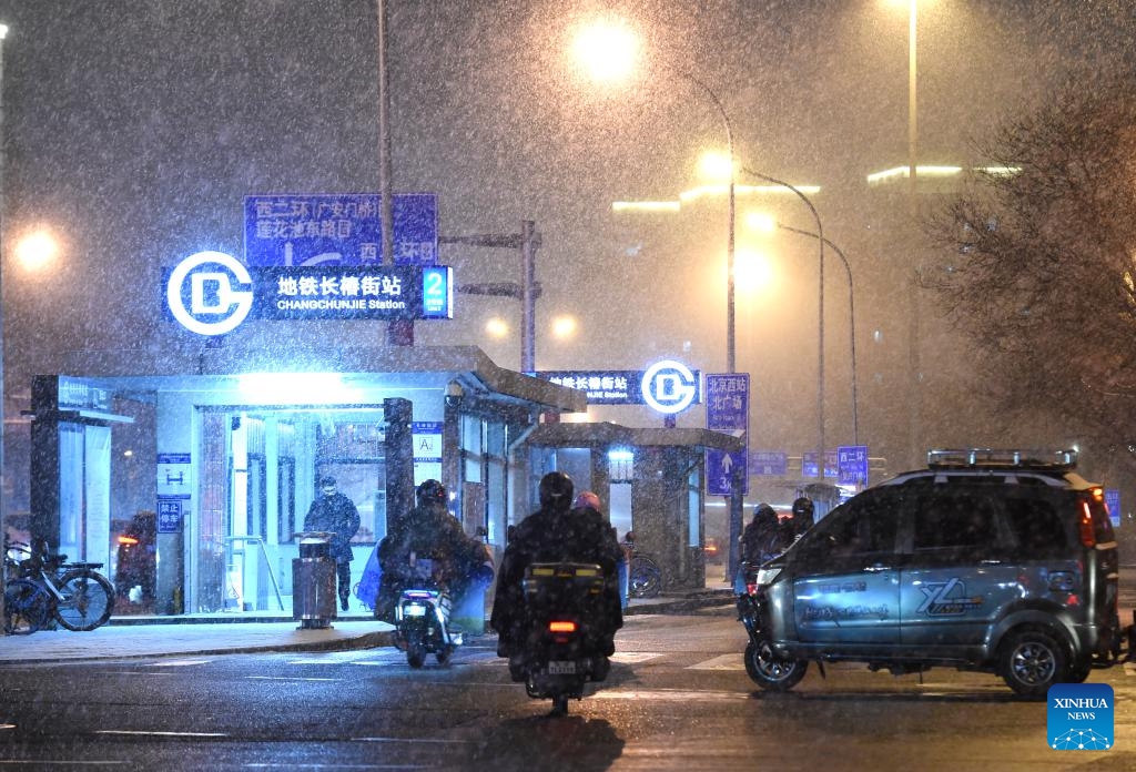 Citizens make their way amidst snowfall in Beijing, capital of China, on Jan. 17, 2026. Beijing witnessed a snowfall on Friday. (Photo: Xinhua)