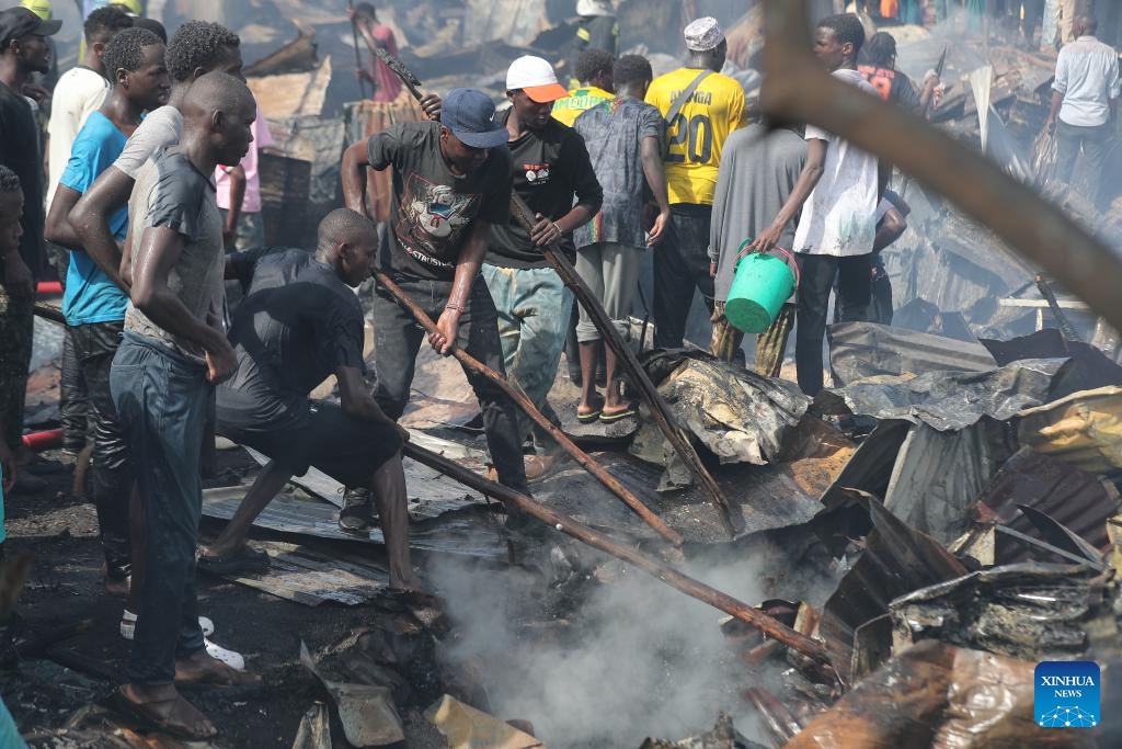 People try to put out a fire in Kibera slum in Nairobi, Kenya, on Jan. 17, 2026. A fire broke out here on Saturday, causing dozens of houses burned down. No casualties have been reported yet. (Photo: Xinhua)
