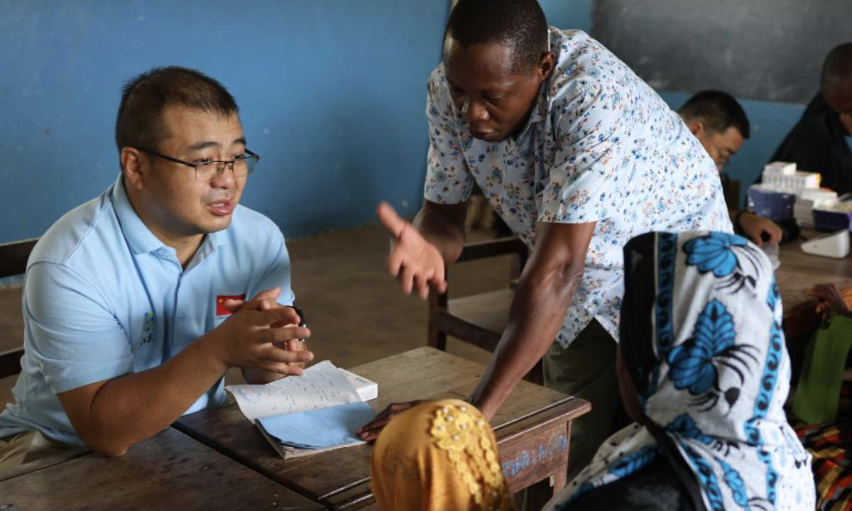 A member (1st L) of the 35th Chinese medical team in Zanzibar provides free medical services on Pemba Island of Zanzibar, Tanzania, on Jan. 20, 2026. Chinese medical experts on Tuesday launched the 100 Medical Teams in 1,000 Villages free medical services program at a community health service center on Pemba Island in Tanzania's Zanzibar.(The 35th Chinese medical team in Zanzibar/Handout via Xinhua)