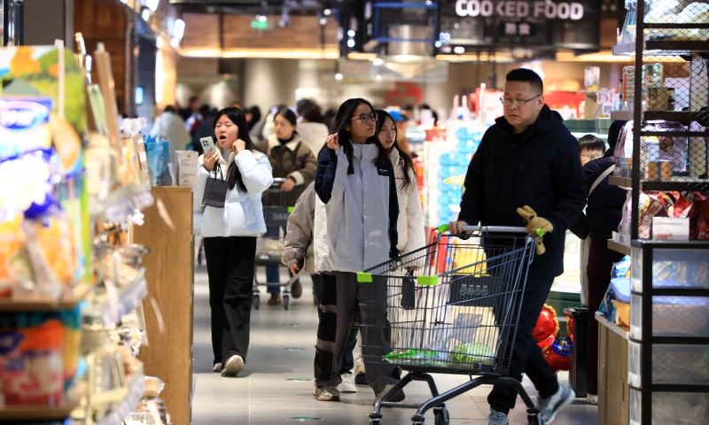 Consumers shop at the food section of a supermarket in Huaian, East China's Jiangsu Province, on December 31, 2025. Photo: VCG
