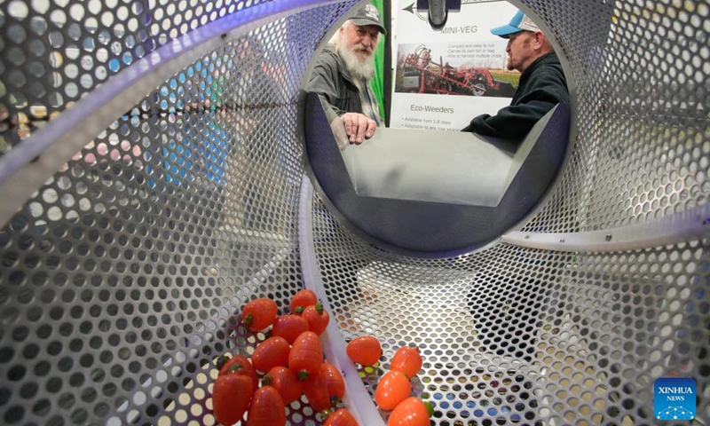 People view a fresh fruit washing machine at the 2026 Pacific Agriculture Show in Abbotsford, British Columbia, Canada, Jan. 22, 2026. The event kicked off here on Thursday and runs until Jan. 24. (Photo by Liang Sen/Xinhua)