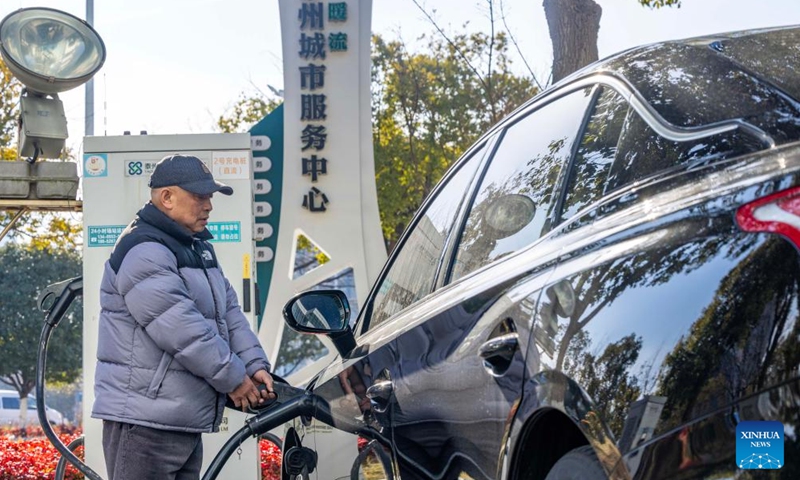 A driver charges an electric vehicle in Taizhou, east China's Jiangsu Province, Jan. 22, 2026. China has built the world's largest electric vehicle (EV) charging network, which can meet the charging demand of more than 40 million new energy vehicles, the National Energy Administration (NEA) said on Wednesday. (Photo by Tang Dehong/Xinhua)

