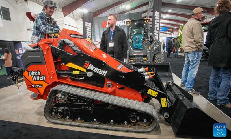 People look at a compact utility loader at the 2026 Pacific Agriculture Show in Abbotsford, British Columbia, Canada, Jan. 22, 2026. The event kicked off here on Thursday and runs until Jan. 24. (Photo by Liang Sen/Xinhua)