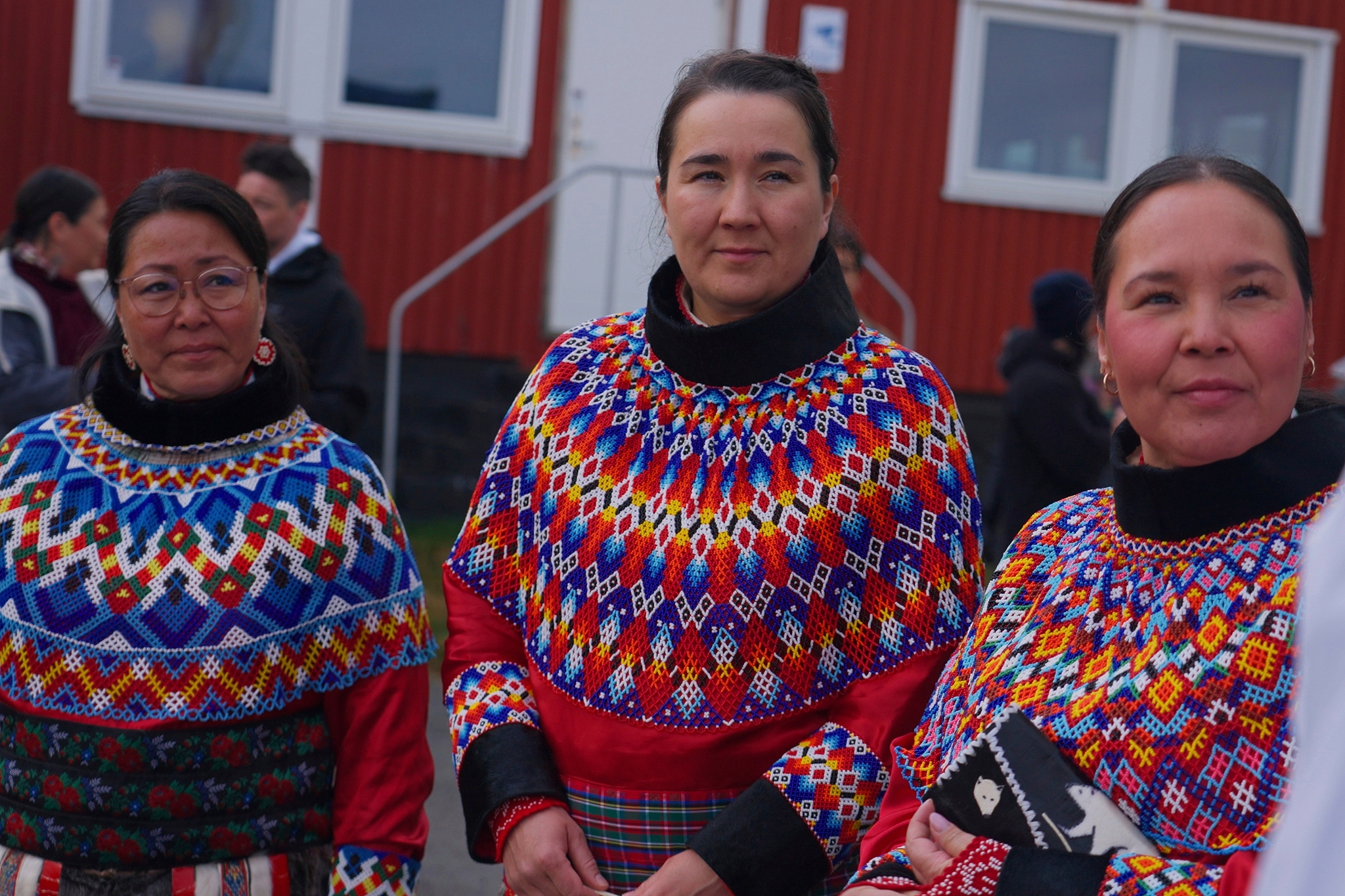 Locals wear traditional clothing made of pearl collars and seal hides on a day of celebration in Nuuk, Greenland. Photo: VCG