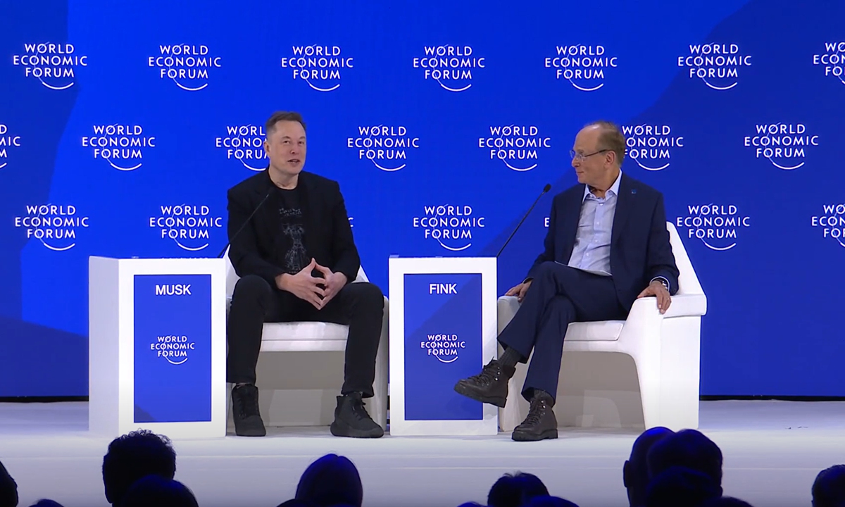 Elon Musk, CEO of Tesla, speaks with Laurence D. Fink, chair and CEO of BlackRock, at the World Economic Forum (WEF) on January 22, 2026. Photo: Screenshot from the official website of WEF