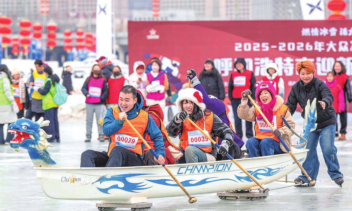 Snow enthusiasts compete in an ice dragon boat race  in Hohhot, capital of North China's Inner Mongolia Autonomous Region on January 25, 2026. Over 100 local ice and snow enthusiasts participated, competing in seven fun events, including ice dragon boat racing, snow tug-of-war, ice cycling and the snow biathlon, fully embracing the speed and excitement of winter sports. Photo: VCG