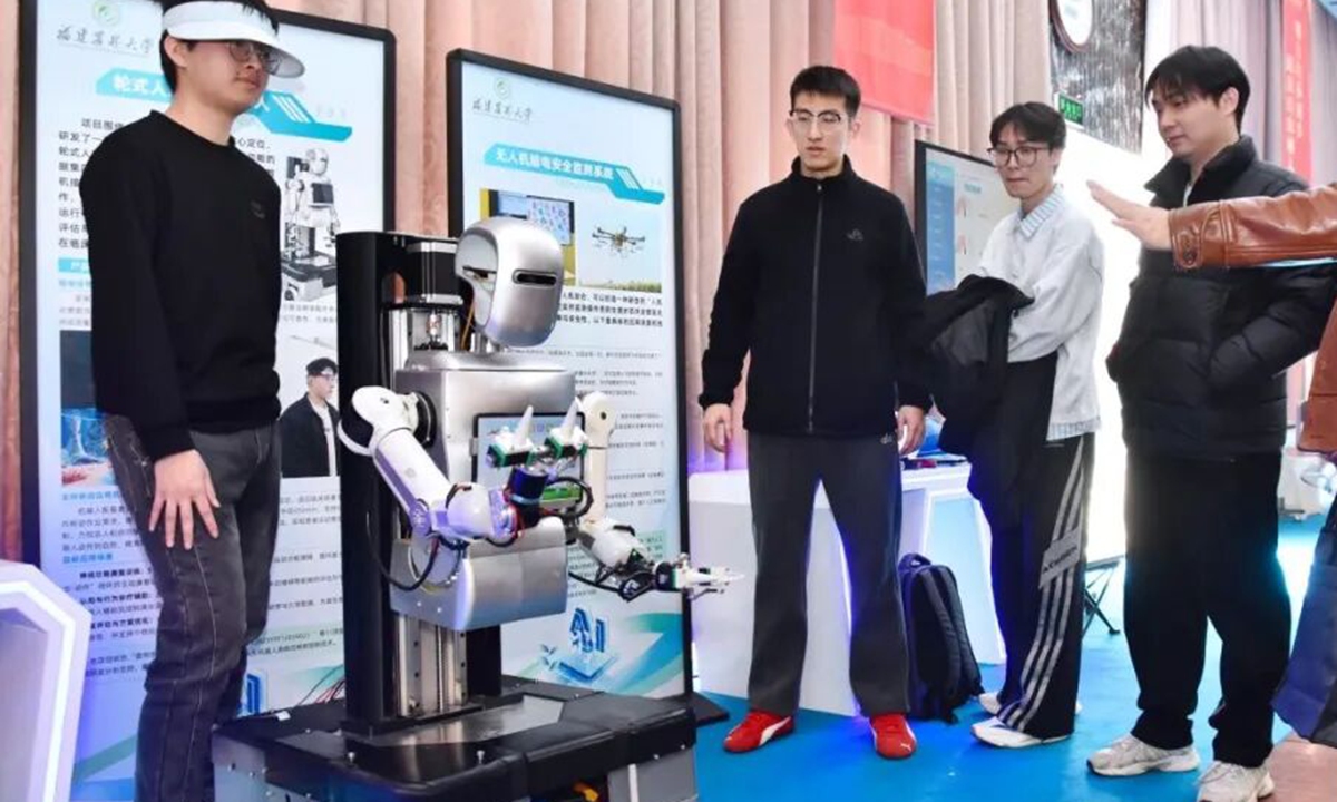 Developers demonstrate the capabilities of Fuxiaozhi F1-D robot. Photo: courtesy of China's Fujian Agriculture and Forestry University 