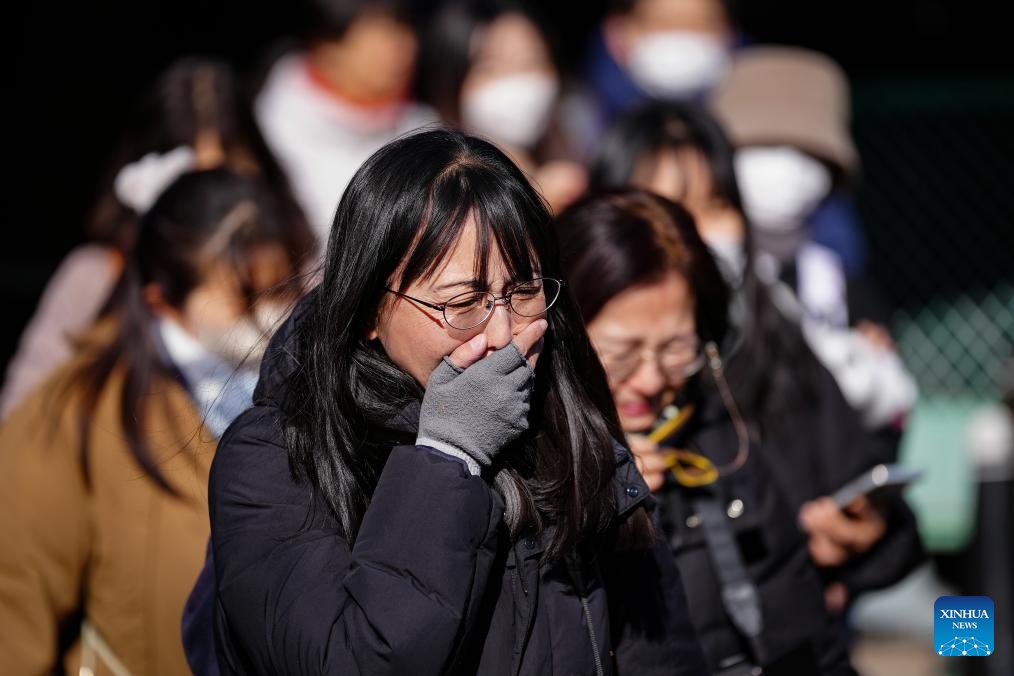 Visitors grief after bidding farewell to giant pandas at Ueno Zoo in Tokyo, Japan, Jan. 25, 2026. Giant pandas Xiao Xiao and Lei Lei, currently residing at a zoo in Tokyo, will depart for China on Jan. 27, marking the first time in about half a century that Japan will be without any pandas, local media reported. (Xinhua/Jia Haocheng)