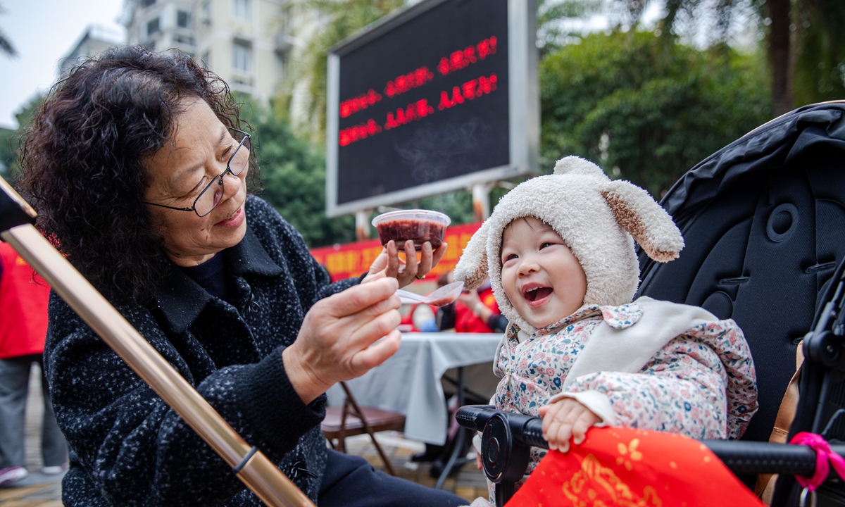 A child tastes Laba porridge in Wenzhou, east China's Zhejiang Province on January 26, 2026. Laba Festival, which falls on January 26 this year, is traditionally regarded as the prelude to Spring Festival. Photo: VCG