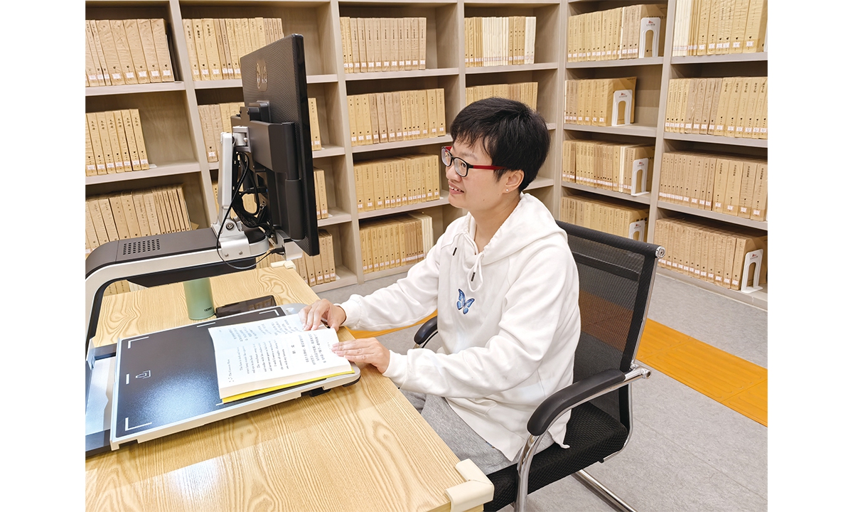 A visually impaired reader enjoys a tactile exhibition about the Beijing Central Axis at the Jiangxi Provincial Library on April 25, 2025. Photo: Courtesy of Jiangxi Provincial Library