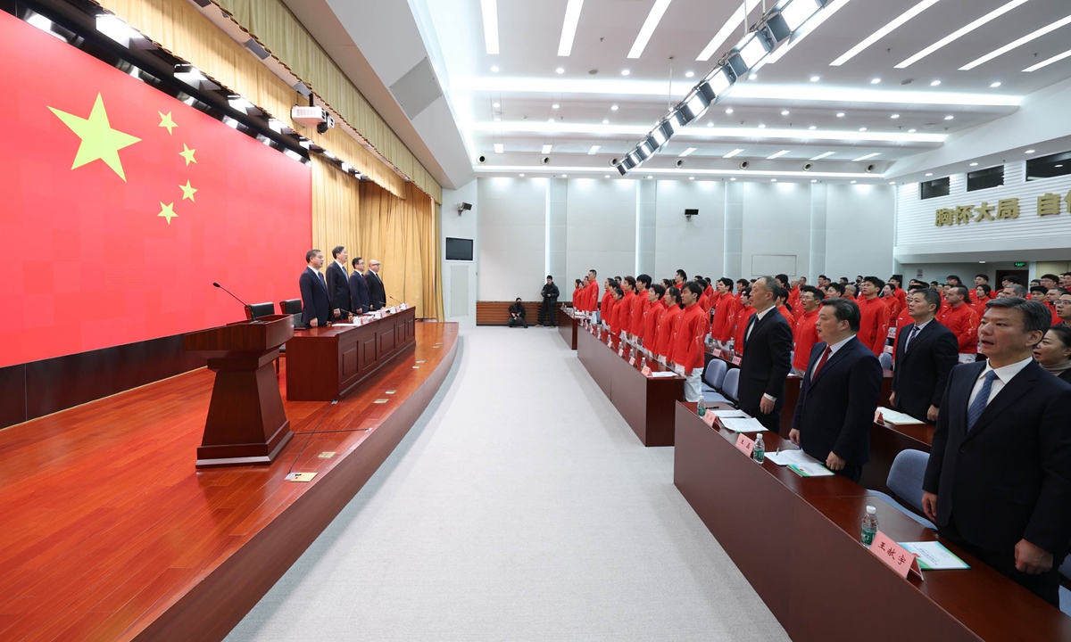 People take part in a flag-raising ceremony at the inaugural meeting of the Chinese delegation for the 2026 Milan-Cortina Winter Olympic Games in Beijing on January 27, 2026. Photo: cnsphoto