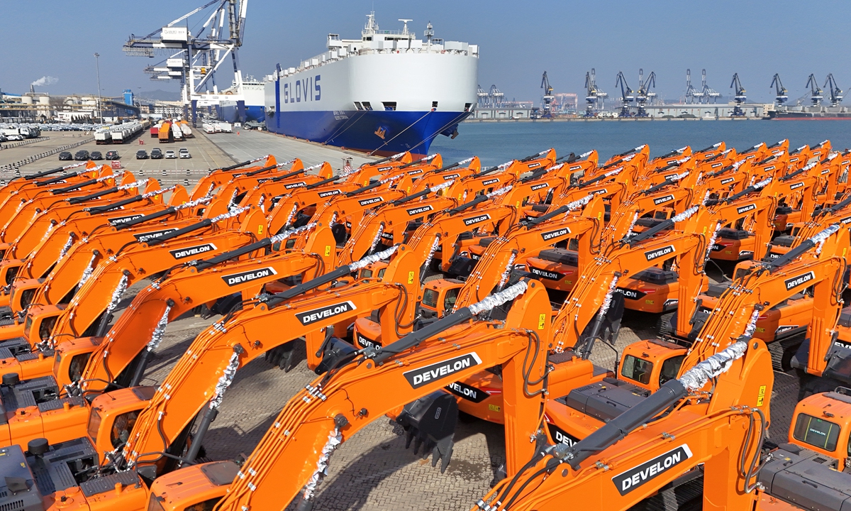 Domestically produced excavators wait to be loaded onto ships for export at Yantai Port in East China's Shandong Province on February 3, 2026. In 2025, the country's major producers exported 116,739 vehicles, surging 16.1 percent year-on-year, industry data showed. Photo: VCG
