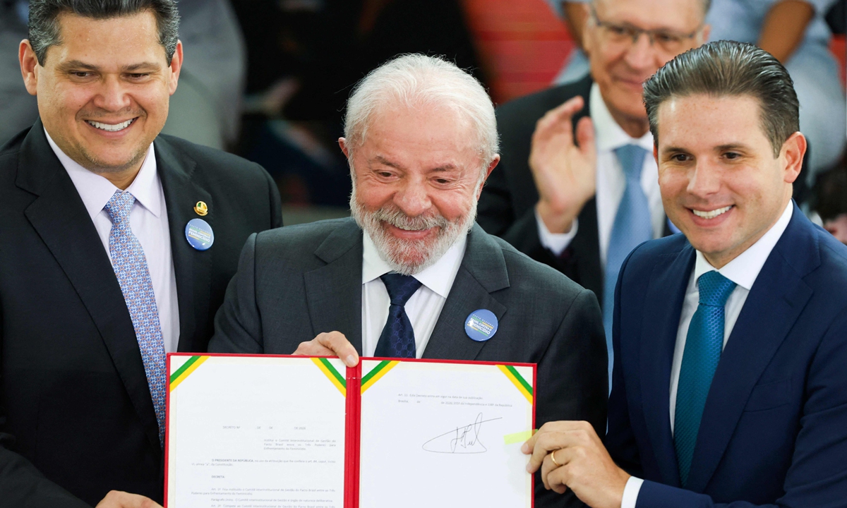 Brazilian President Luiz Inacio Lula da Silva (center) and senior government officials of Brazil hold a signed document during the launch ceremony of the Brazil Pact to Combat Femicide at the Planalto Palace in Brasilia, on February 4, 2026. The plan outlines coordinated and permanent action among branches of government with the aim of preventing violence against girls and women in Brazil. Photo: VCG