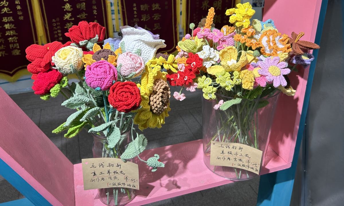 Flowers handmade by people with disabilities are displayed for sale in the Guangming Experience Hall. Photos: Liang Rui/GT