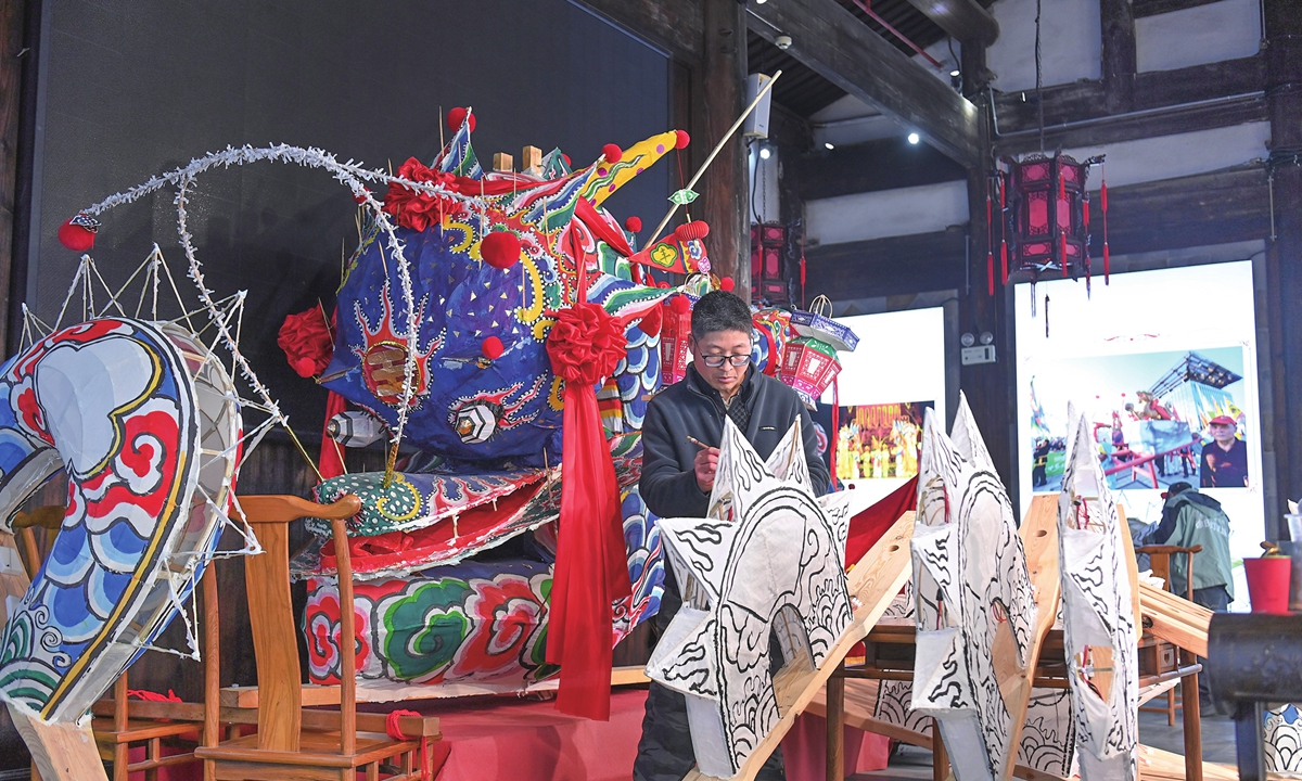 A worker crafts a traditional dragon lantern at a workshop in Dongyang, East China's Zhejiang Province  to welcome the Spring Festival on February 5, 2026. Dongyang's lanterns are sold across the country, with particularly strong demand in Shanghai and other parts of Zhejiang. Photo: VCG