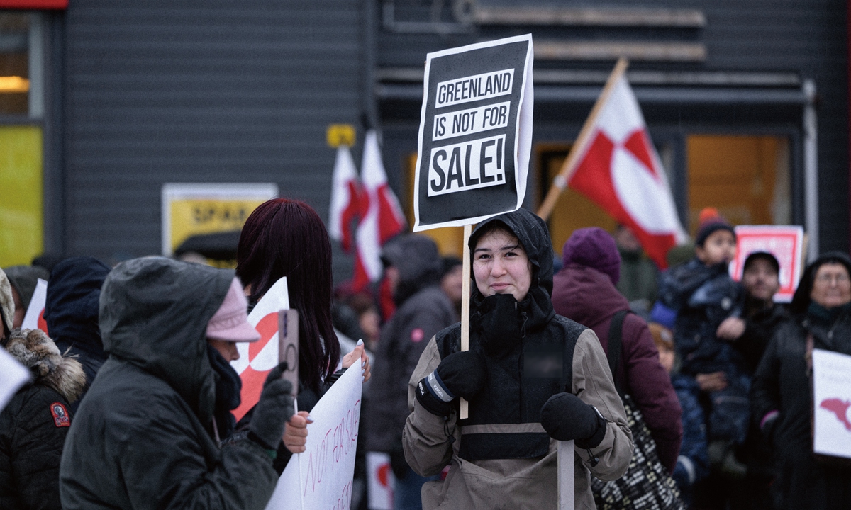 A local resident in Greenland holds a 