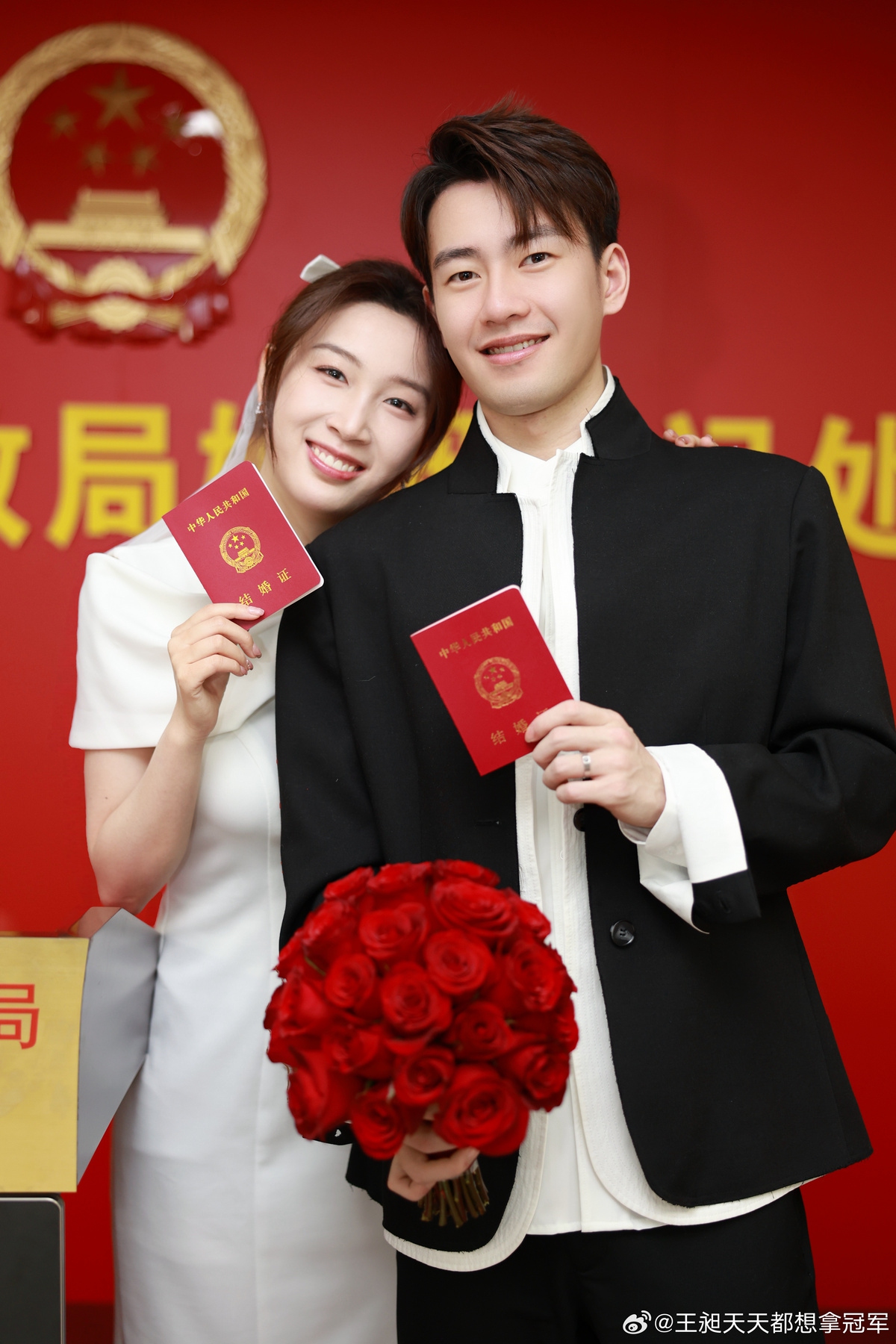 Wang Chang (right) and Qian Tianyi hold the marriage certificates at Dongcheng District Civil Affairs Bureau in Beijing on February 7, 2026. Photo: Weibo of Wang Chang